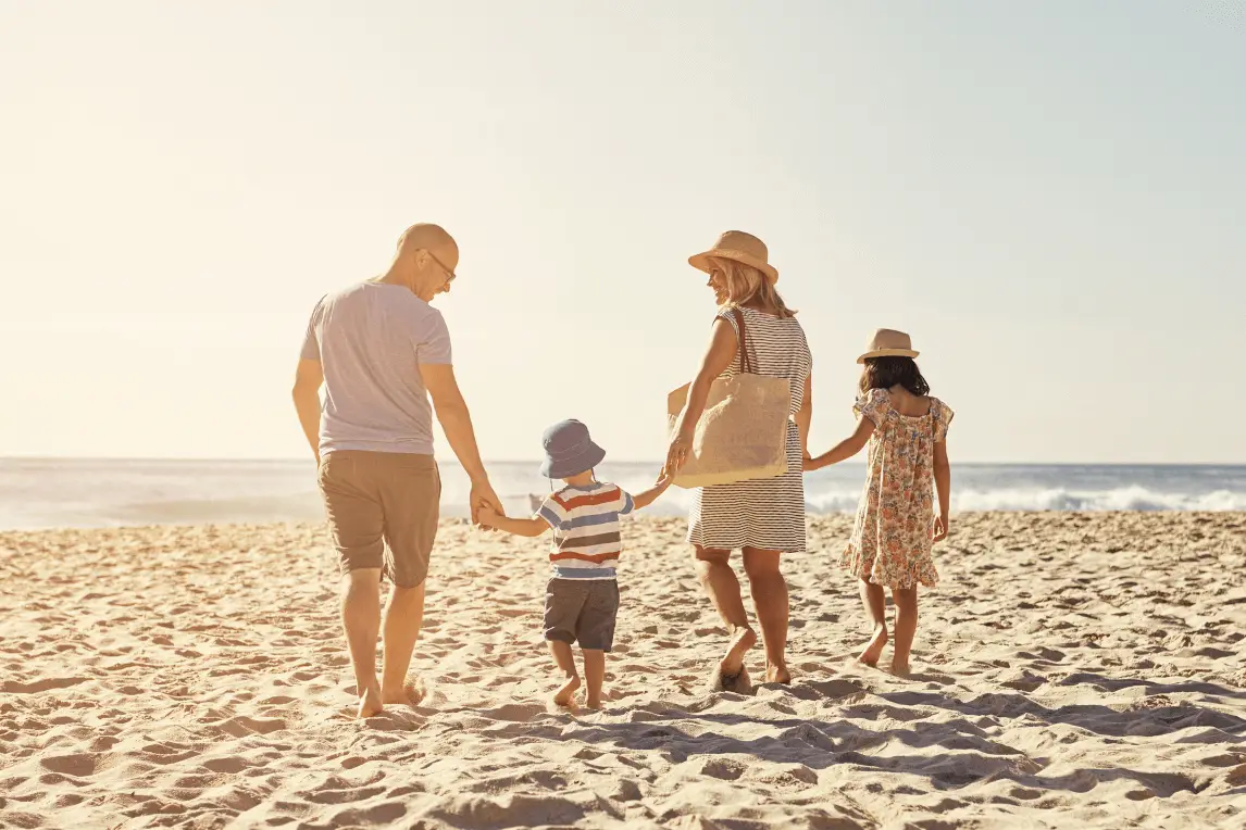 family at the beach during the summer
